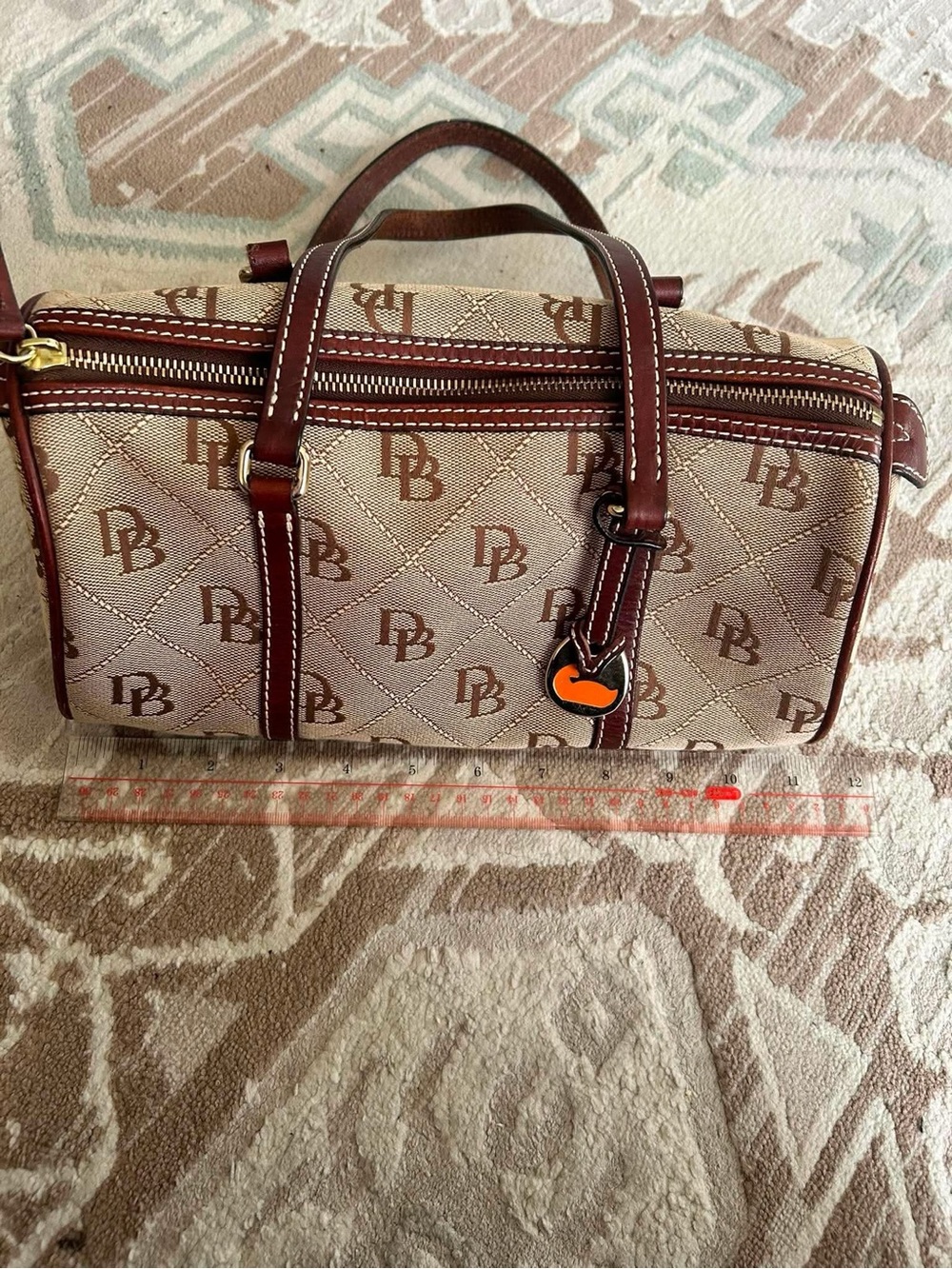 Dooney & Bourke Brown Monogram Barrel Bag with Maroon Trim